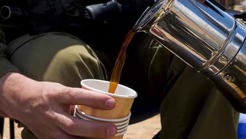 Israeli soldier serving during a break